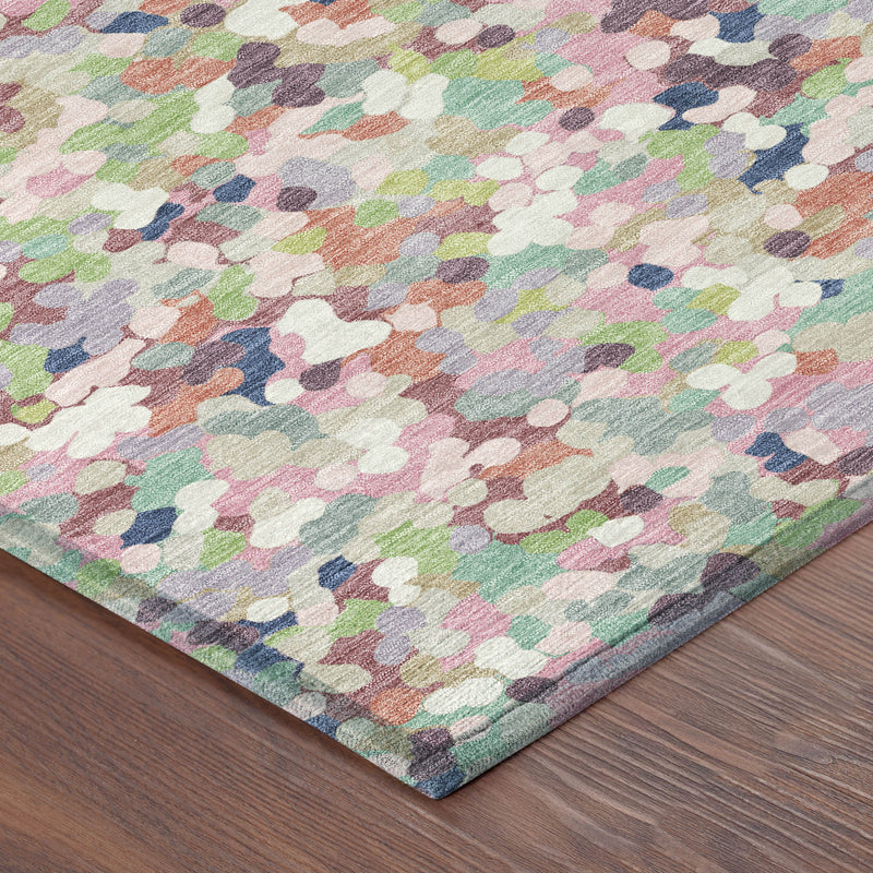 Pastel geometric confetti area rug corner with low-pile texture; blush, pink, blue, green