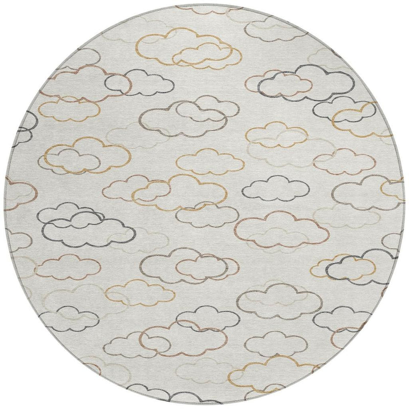 Round area rug with dense cloud outlines in gray, gold, and rust on light base