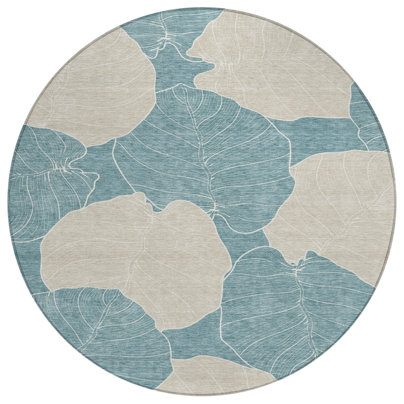 Round teal and ivory leaf-pattern area rug with off-white centers