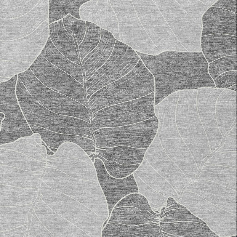 Gray and ivory floral leaf motif on washable indoor outdoor area rug, close view
