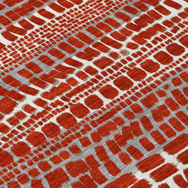 Abstract area rug with red and dark gray brick pattern over light background
