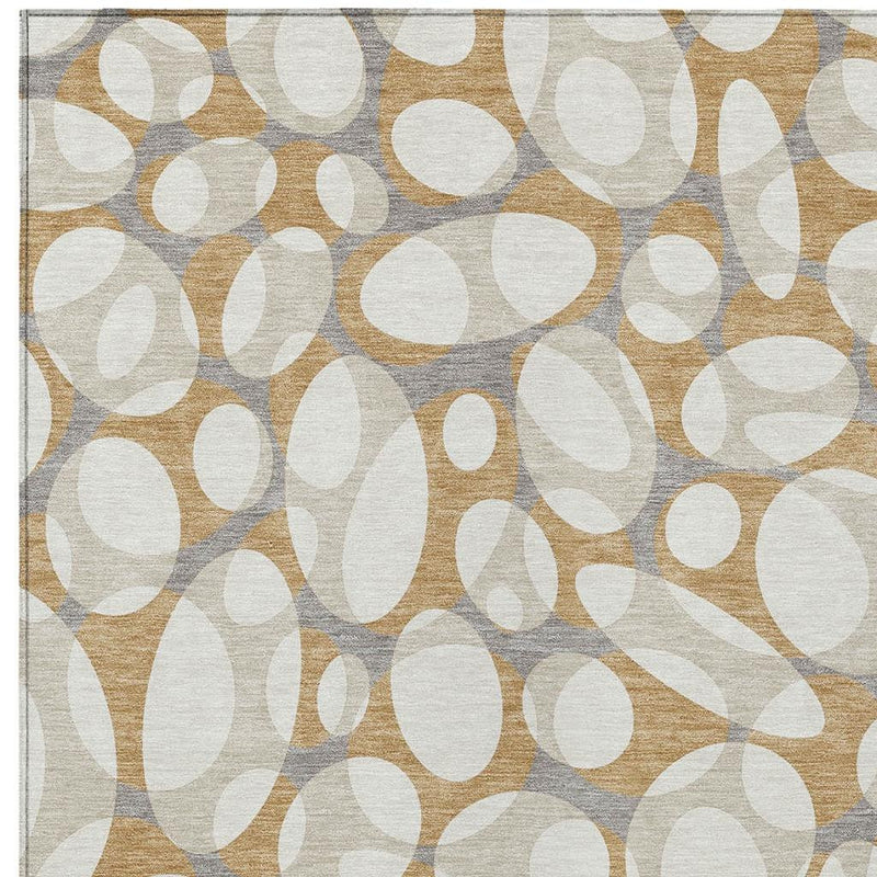 Abstract area rug with white ovals over beige and gray field with tan accents