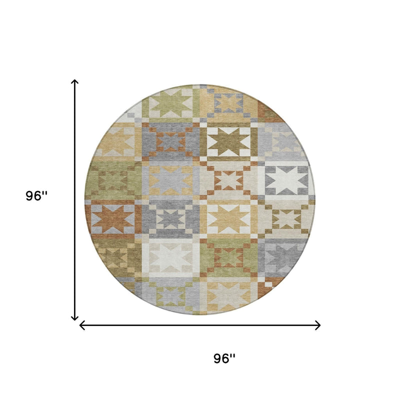 Round patchwork area rug with multicolor geometric squares and star blocks in gray and green.