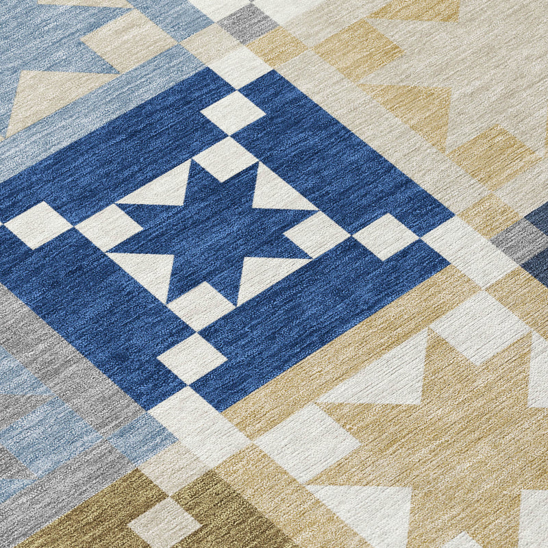 Patchwork area rug with central navy star, white accents, and tan/blue border