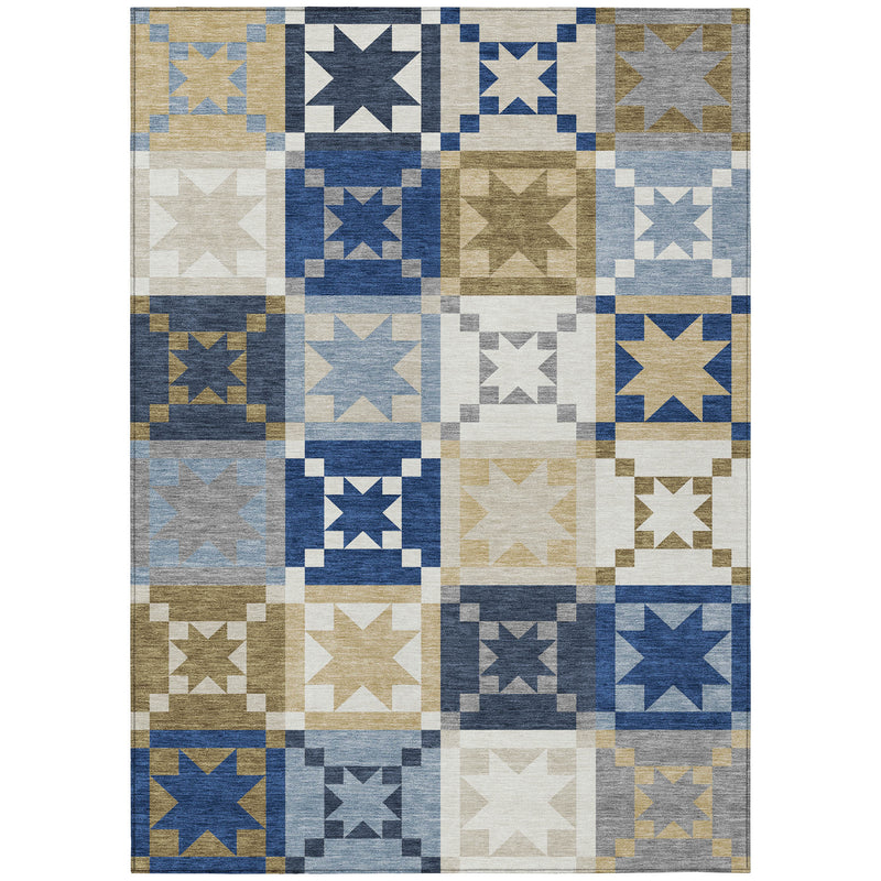 Patchwork indoor outdoor area rug with repeating star blocks in blue, tan, gray, white