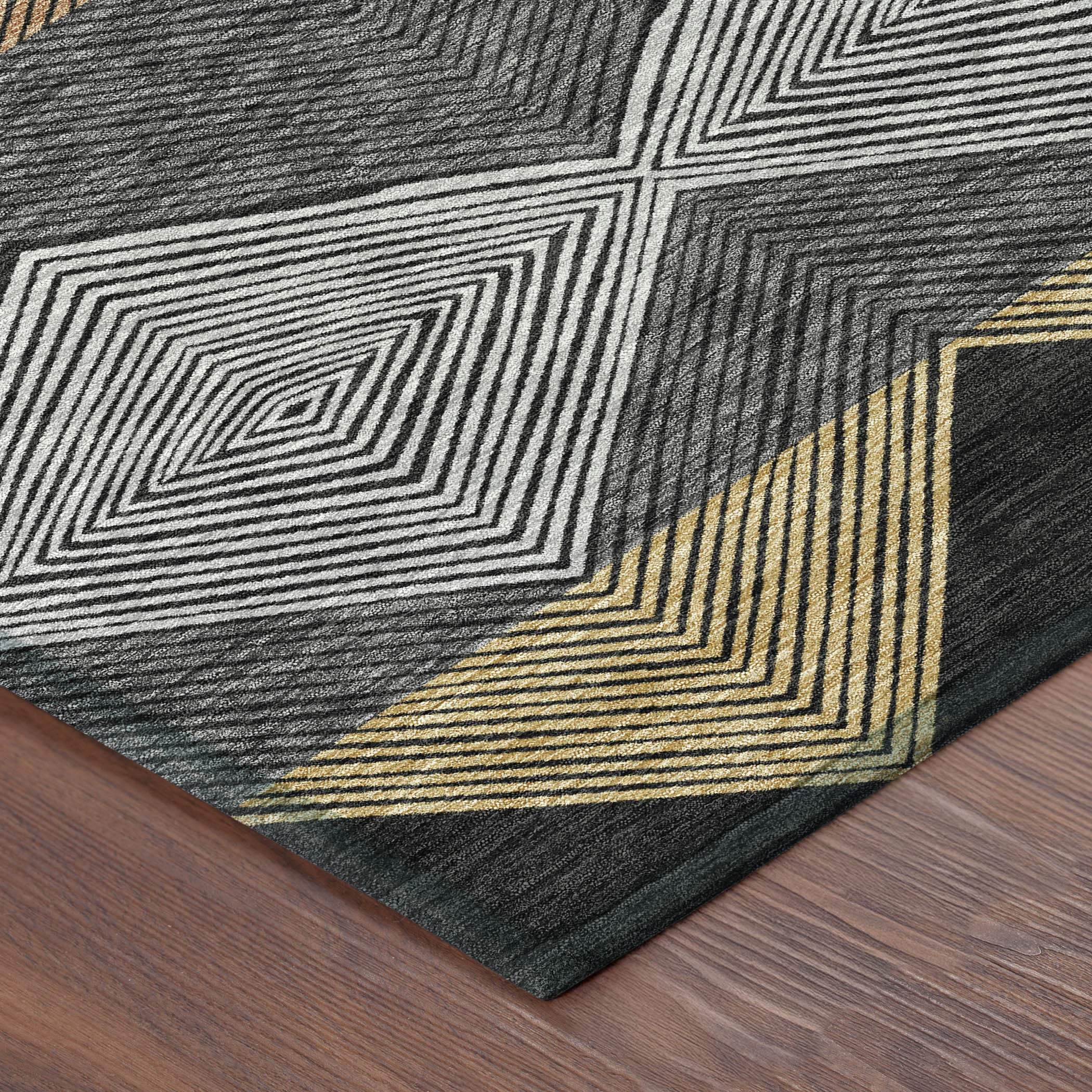 Geometric black, white, and gold area rug, featuring intricate line patterns on a soft, durable fabric.