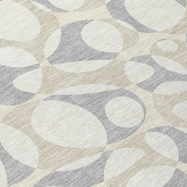 Round abstract area rug with ivory and light gray organic shapes