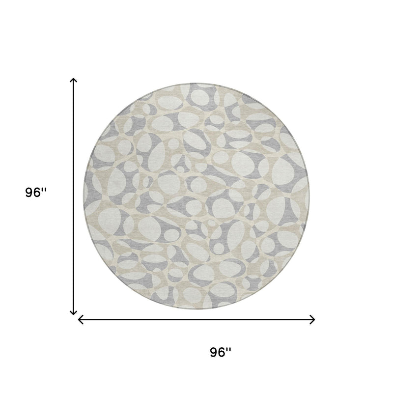 Round area rug, 96 in diameter, abstract ivory and light gray oval design