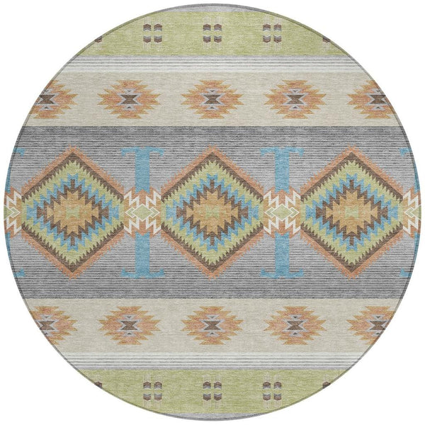 Round area rug with southwestern diamond motifs in green, brown, blue, and gray