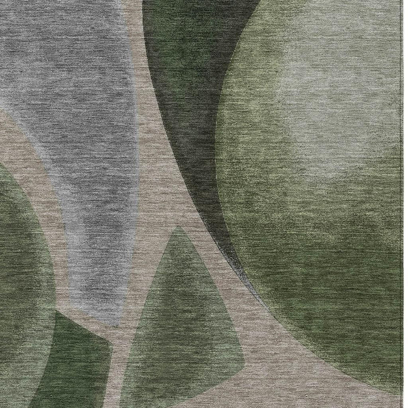 Close-up of rectangular area rug with layered green and gray abstract curves