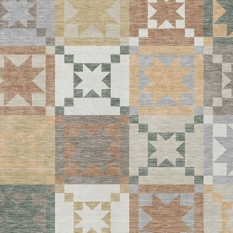 Patchwork rug close-up with star motifs in ivory, cream, gray, and muted blue-green