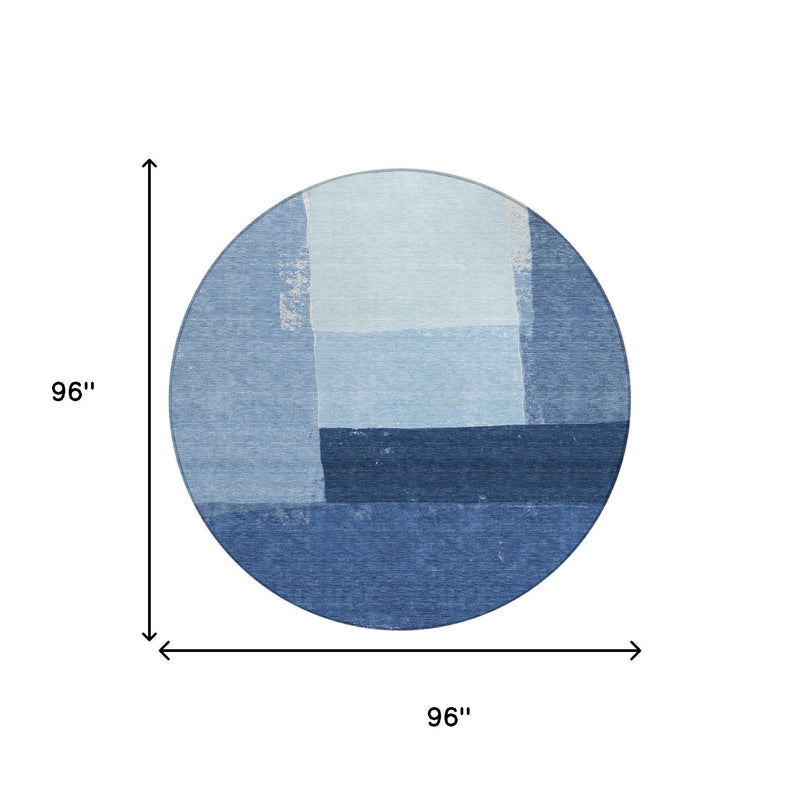 96 in round blue geometric area rug with light center and dark banding