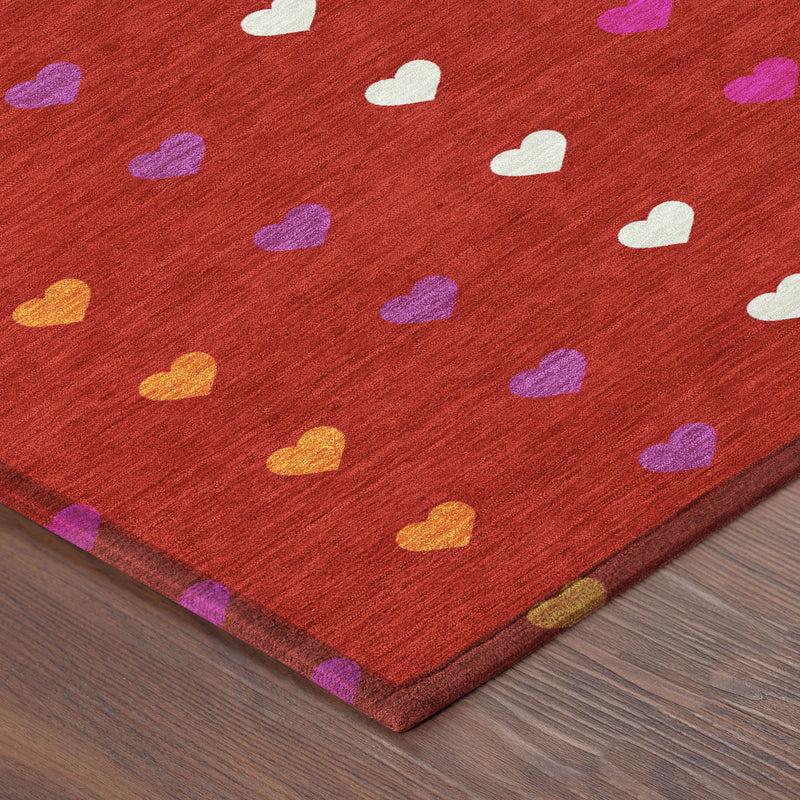 Red heart-pattern area rug with multicolor hearts and textured surface