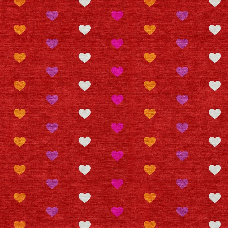 Red heart-pattern area rug close-up with scattered multicolor hearts