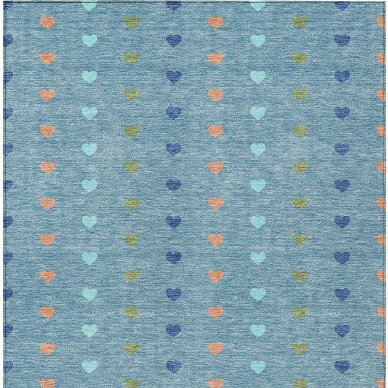 Teal blue area rug with tightly packed repeating hearts in pastel colors