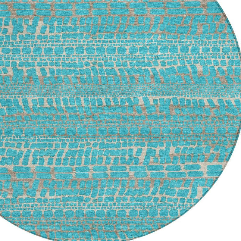 Round rug close-up: teal abstract brick pattern with beige highlights and border