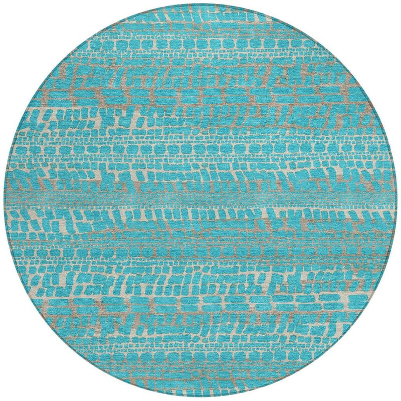 Round teal and turquoise abstract area rug with repeating brick-like motif
