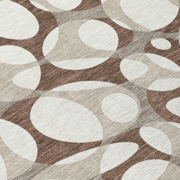 Indoor outdoor area rug with abstract oval pattern in chocolate brown and beige