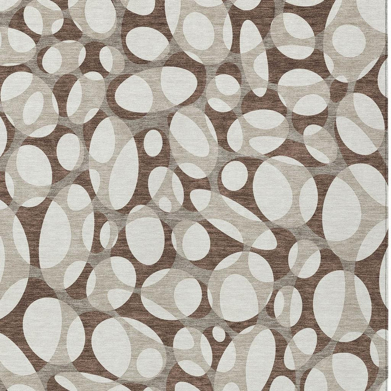 Chocolate brown and beige abstract rug with repeating oval motif