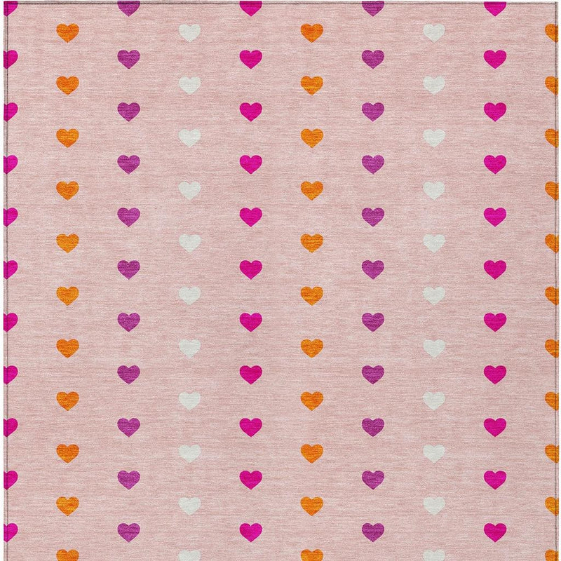 Pink and ivory heart-pattern area rug with multi-color hearts, top-down view