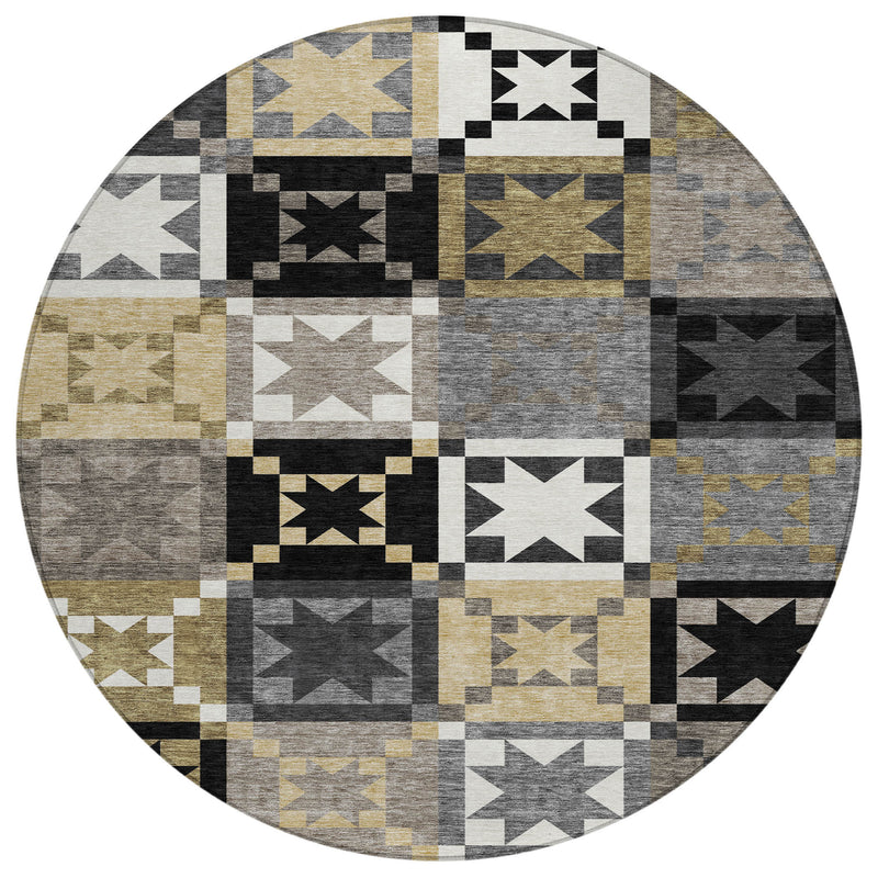 Round patchwork area rug featuring star-and-tribal geometric panels in black and gray