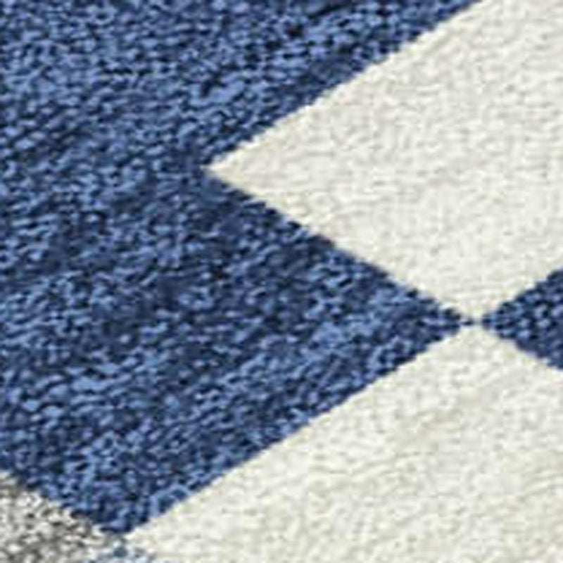 Blue and cream geometric patchwork area rug with textured short-pile diamond pattern