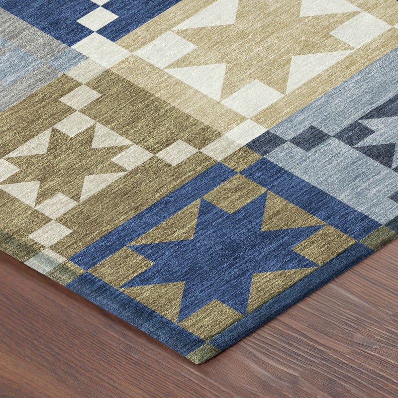 Navy, tan, and cream geometric patchwork area rug with centered star medallion
