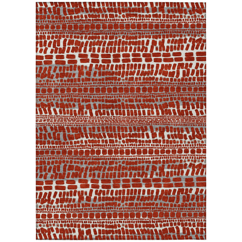Rectangular rug with red and gray abstract brick pattern, even border edges