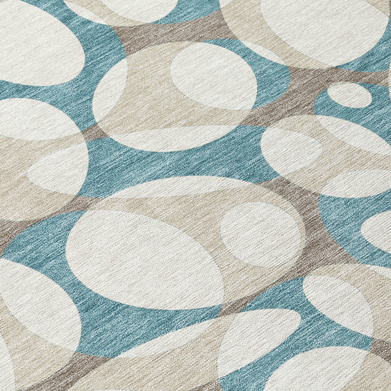 Teal and ivory abstract oval area rug corner with woven look