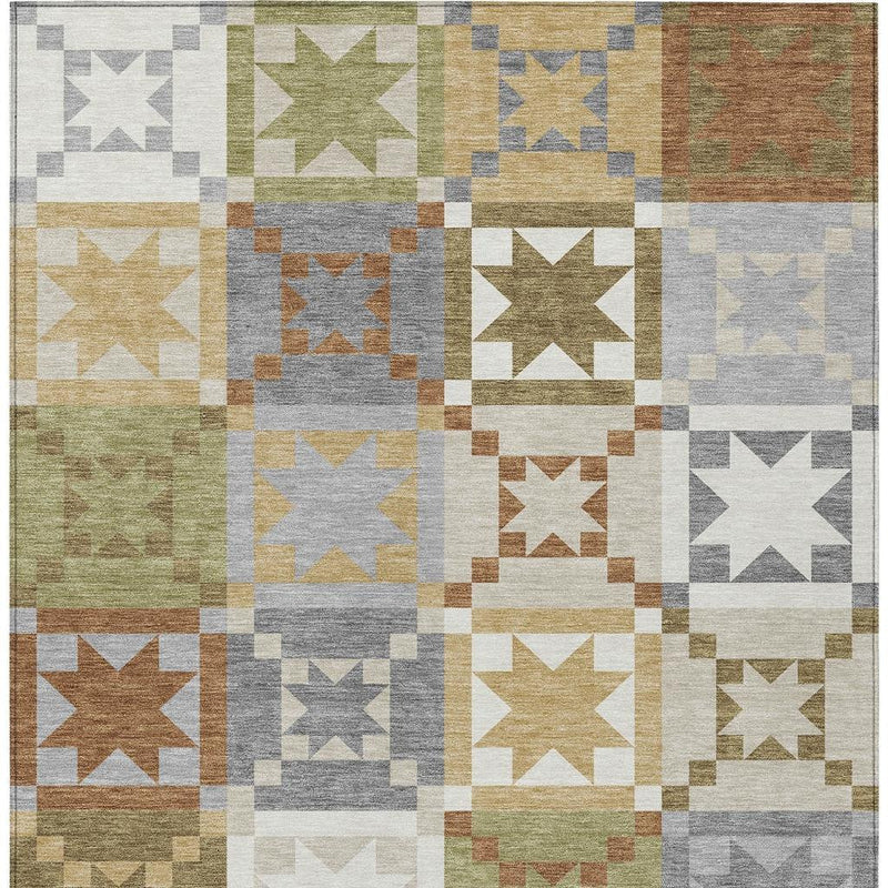 Patchwork area rug featuring square blocks with stars in gray, green, and warm tan