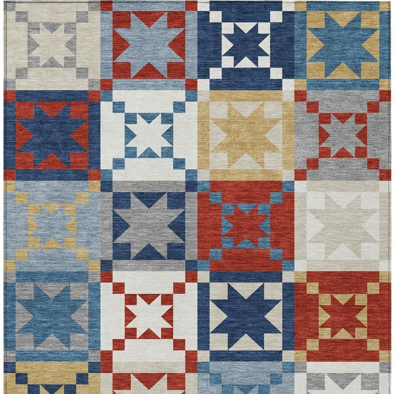 Patchwork area rug featuring square star motifs in navy, red, gold, white, and gray