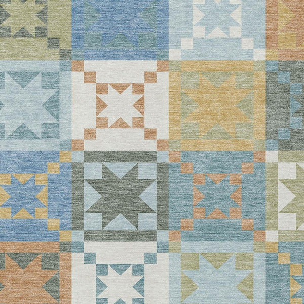 Washable indoor/outdoor area rug with blue, green, tan patchwork star blocks