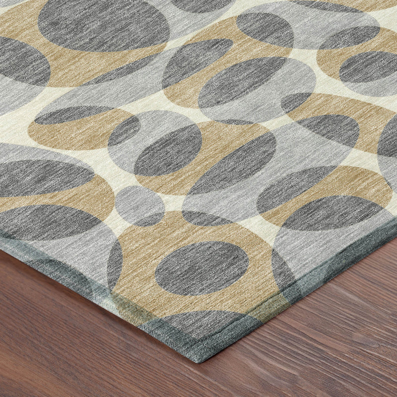 Abstract area rug corner with gray and beige oval pattern on textured surface