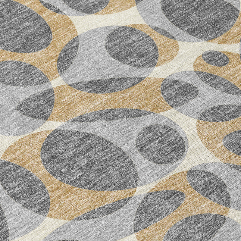 Round area rug detail with layered gray oval motifs and beige linear accents