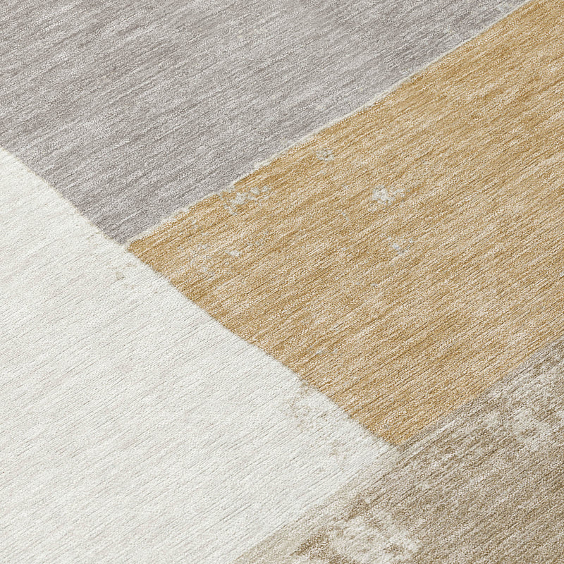Close-up of rug texture showing gray, ivory, and gold-beige diagonal panel