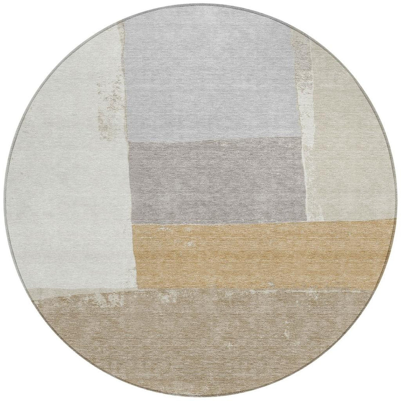 Round area rug with geometric patchwork blocks in light gray, ivory, and beige