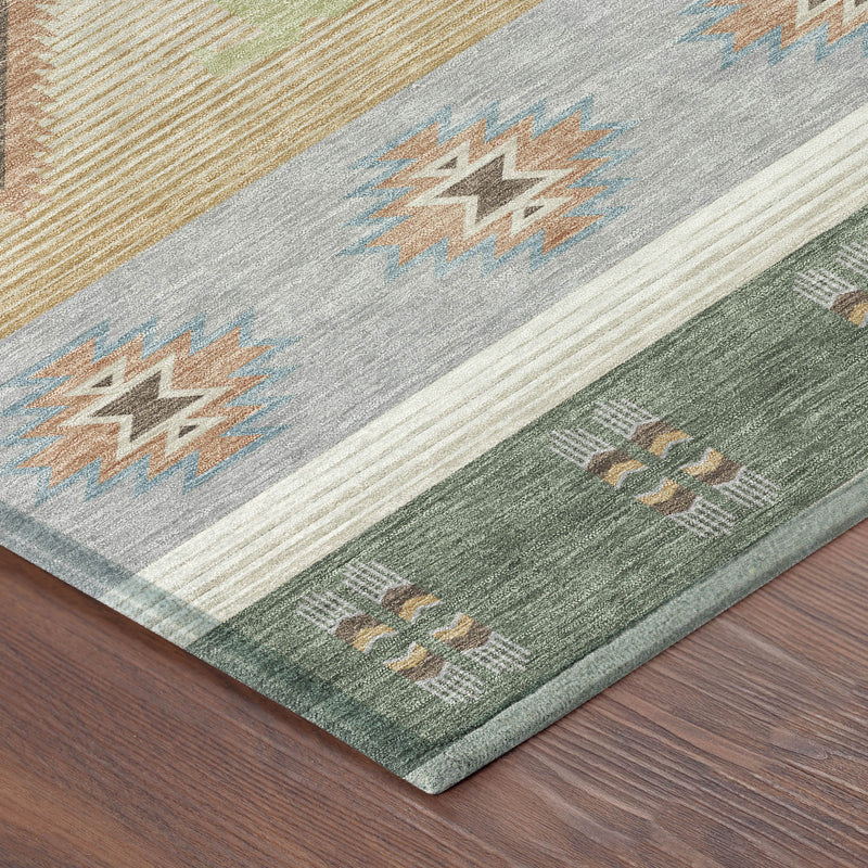 Corner of round area rug with gray, green, and tan bands and geometric icon pattern