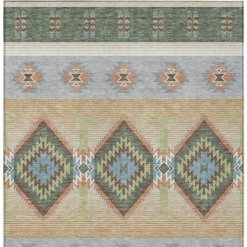 Green and tan southwestern area rug with diamond medallion motifs and horizontal stripes.