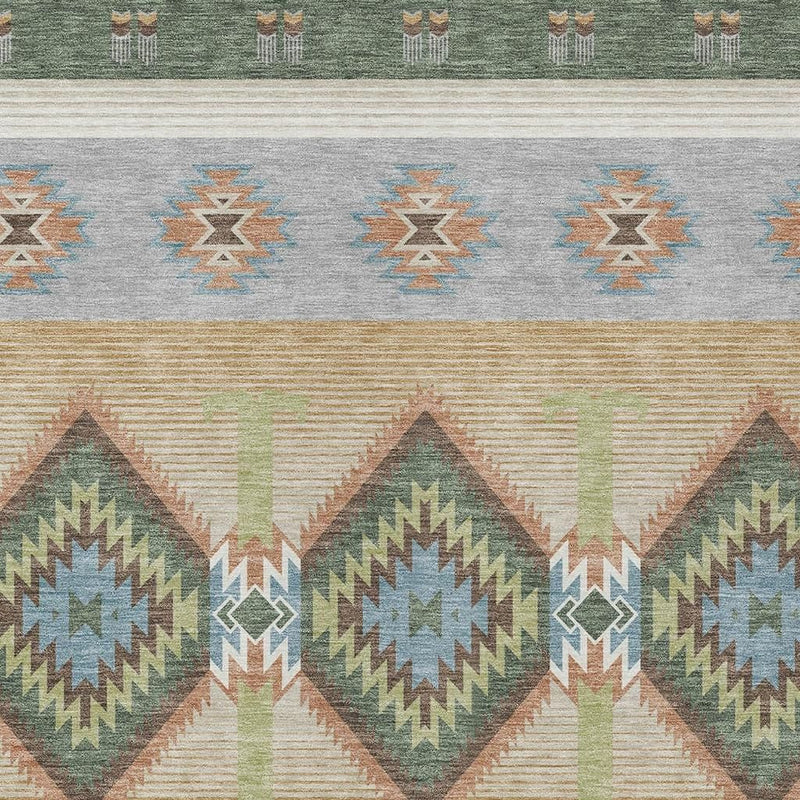 Close-up southwestern area rug with green border, tan ground, and repeating diamond shapes.