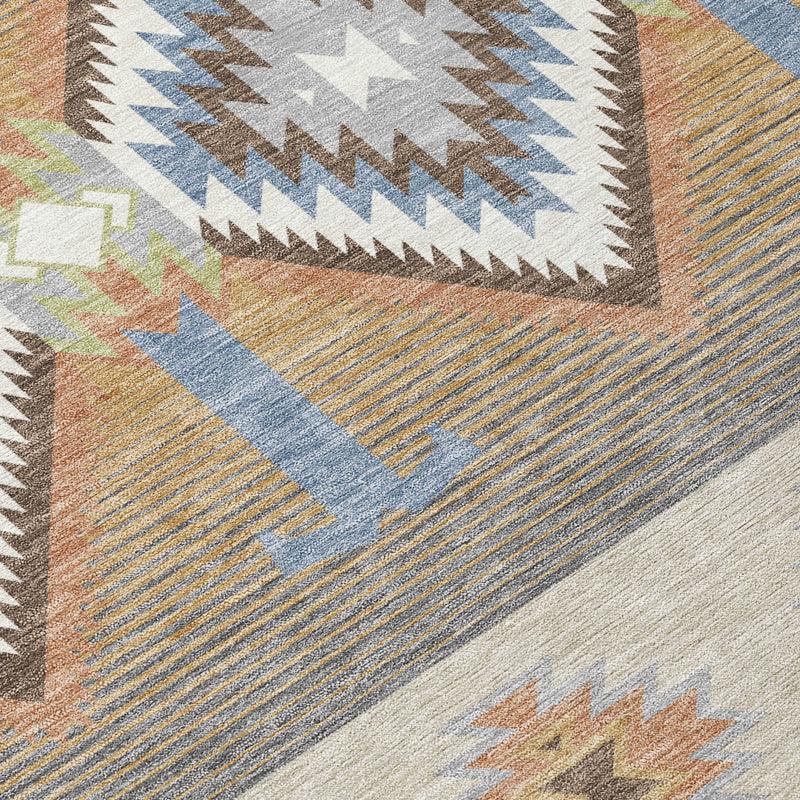 Round area rug texture close-up with multicolor geometric zigzags and diamond motifs