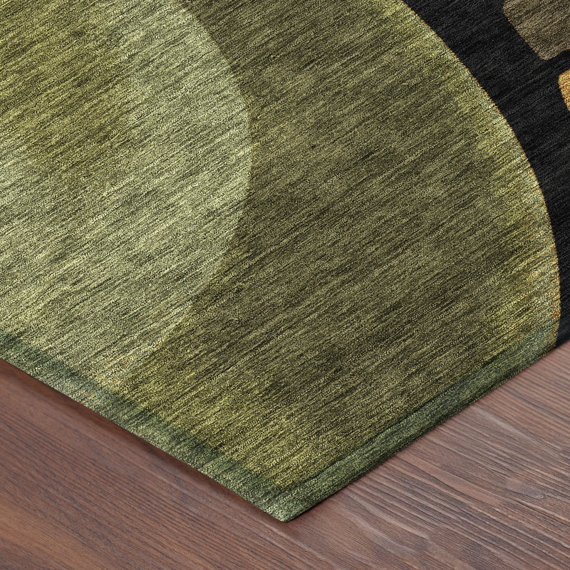 Abstract area rug corner with textured green and gray pattern on a flat weave