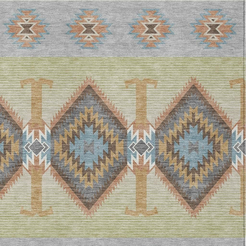 Geometric southwestern area rug with repeating diamond medallions in gray, green, and tan