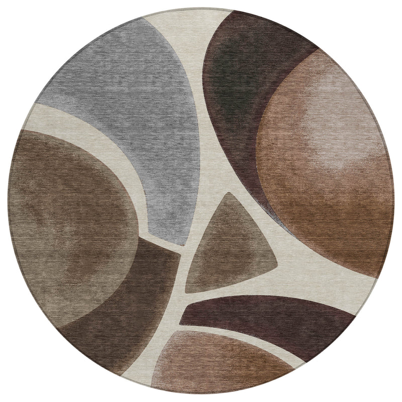 Round abstract area rug with off-white background, gray and brown curved designs