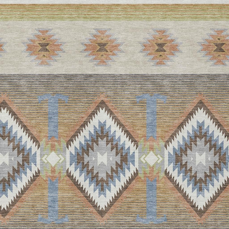 Southwestern area rug detail: three beige-and-blue diamond motifs on ivory with zigzag borders