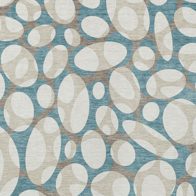 Teal blue and ivory rug with close-up abstract oval shapes pattern