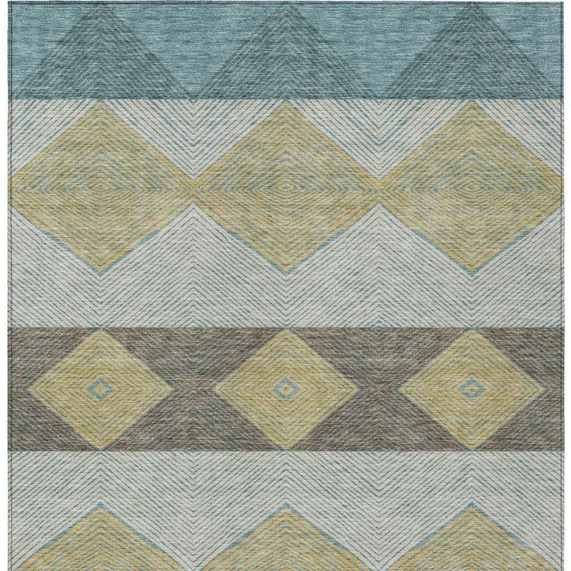 Blue and gold geometric area rug with diamond and chevron patterns in bands