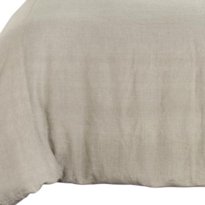 Light beige comforter fabric close-up with subtle linen-like texture
