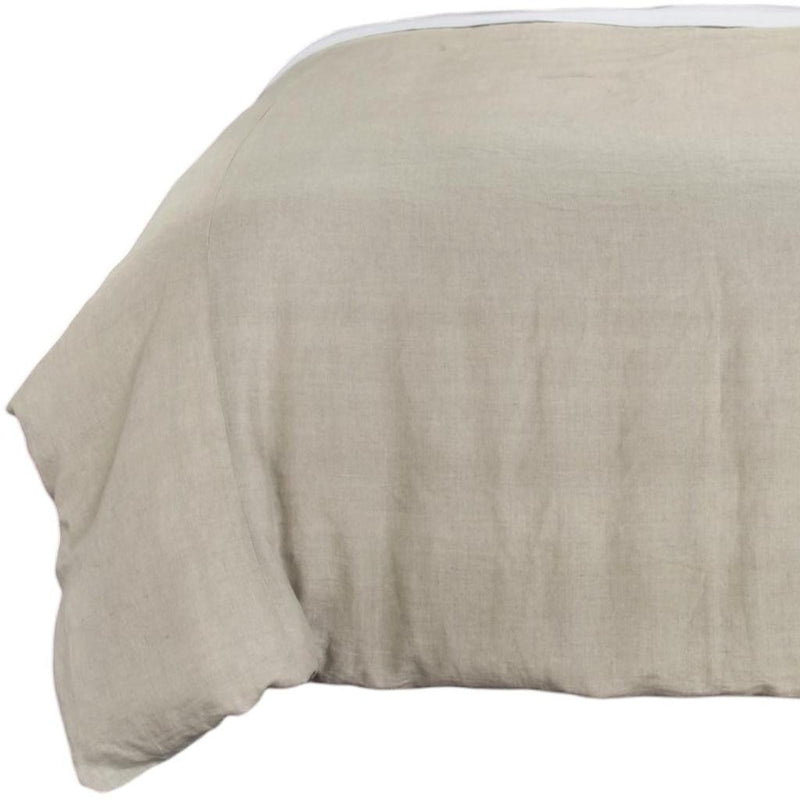 Light beige comforter showing one side drape and stitched edge