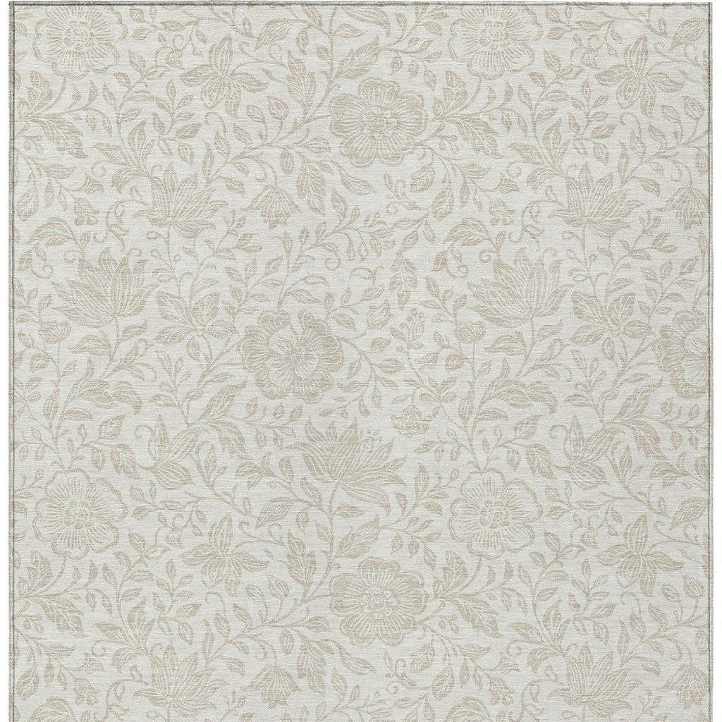 Ivory floral area rug with beige leaf-and-bloom pattern