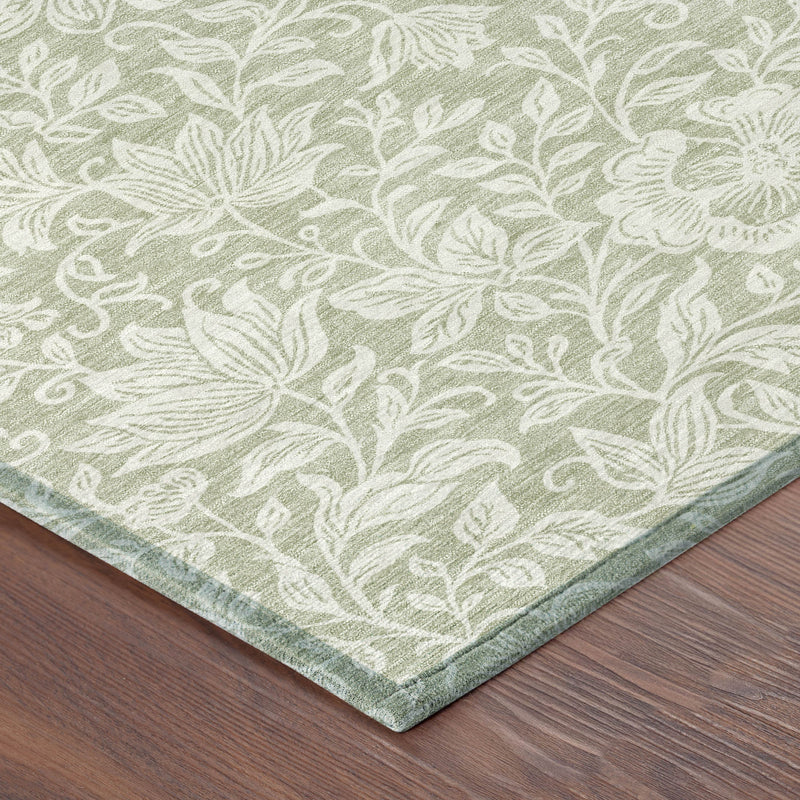 Green and ivory floral area rug corner, leaf and blossom motif with border edge
